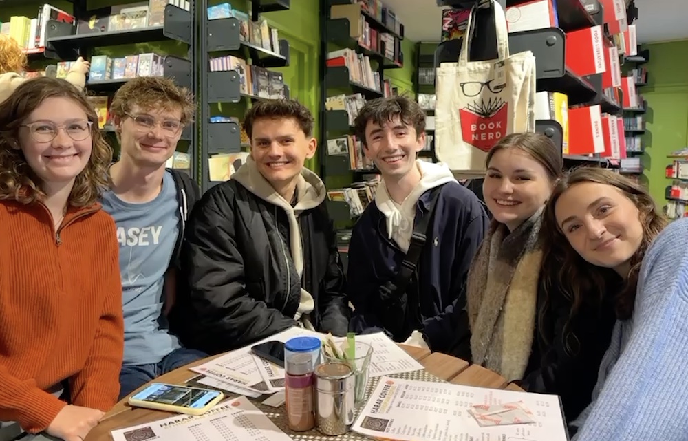 ͯŮ student Peter and a group of friends in a Brussels cafe
